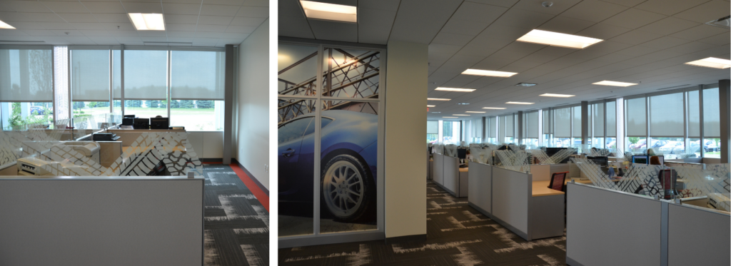 Custom decorative acrylic panels used as cubicle dividers in a corporate office with a tire tread pattern.
