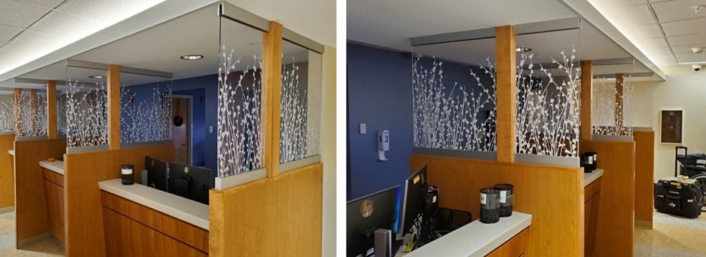 Example of biophilic artwork in healthcare using a printed wildflower pattern on an acrylic panel to separate healthcare check desks.